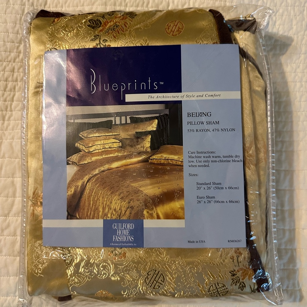 Gold Satin Luxury Pillow Sham with brown trim.